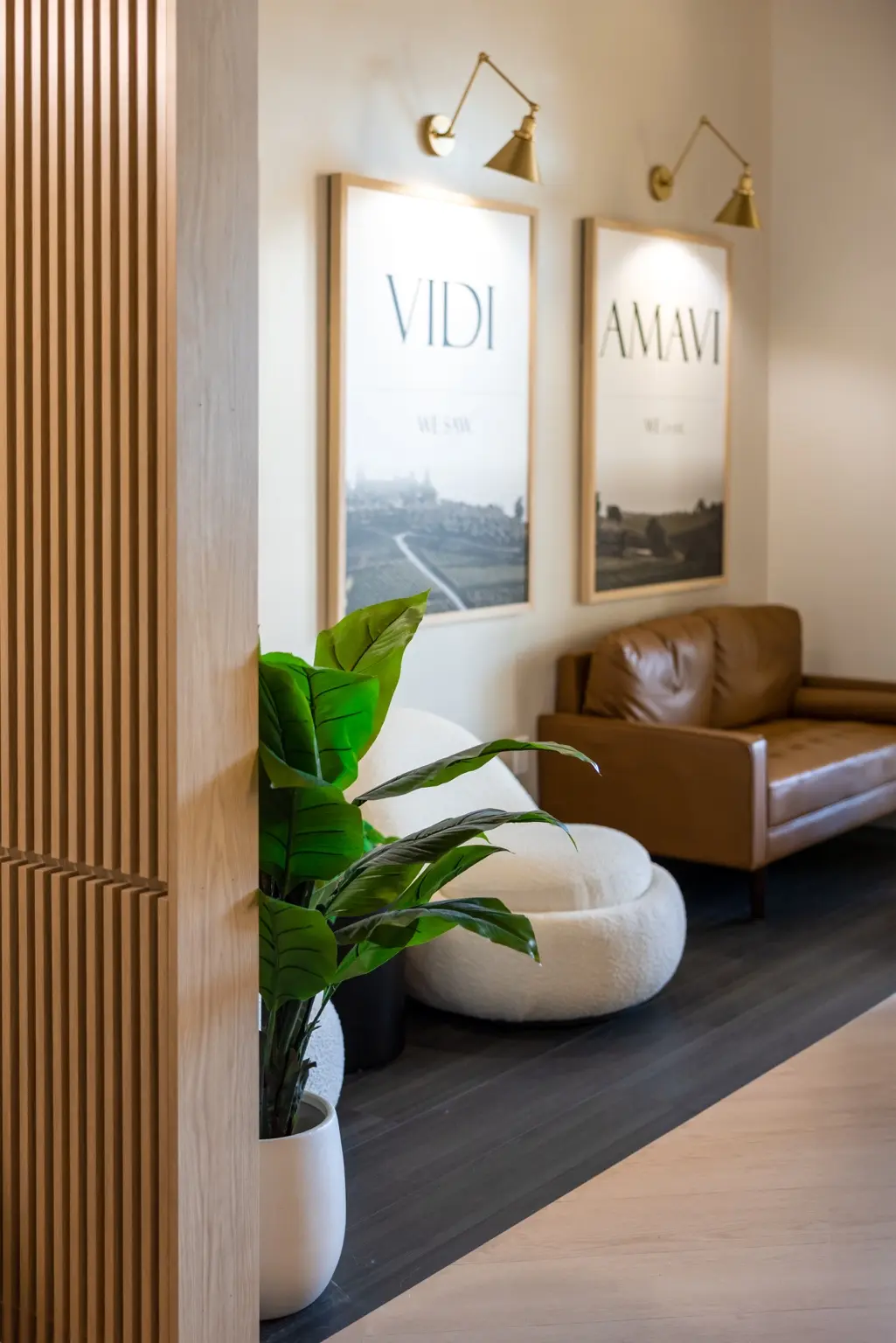 The warm, welcoming guest lounge at AMAVI Salon in Naples, Florida
